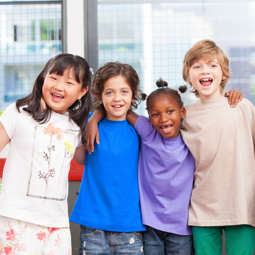 Multi ethnic classroom. Afro american, asian and caucasian prima